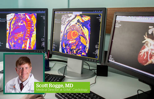 Scott Rogge, MD, and three screens displaying cardiac computed tomography angiography images