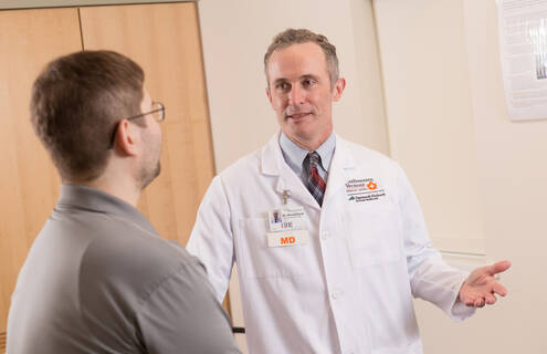 A provider talks to a patient