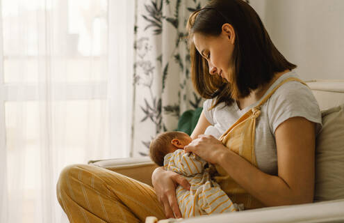 A mother breastfeeding her baby